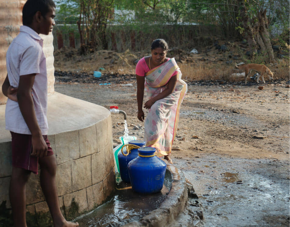 Water supply is unreliable in drought-prone Tamil Nadu. Sharmila fetches what she can for her grandmother and family to use.